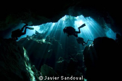 3 cave divers doing deco stop at cenote chacmool, Mexico by Javier Sandoval 